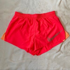 bright pink/orange Nike shorts